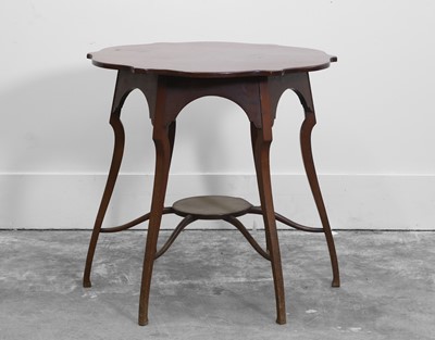 Lot 534 - A mahogany shaped occasional table