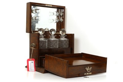 Lot 311 - An oak cased tantalus