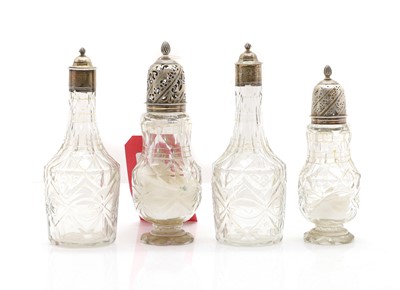 Lot 153 - A group of cut-glass bottles and sugar casters