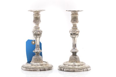Lot 14 - A pair of French cast silver candlesticks