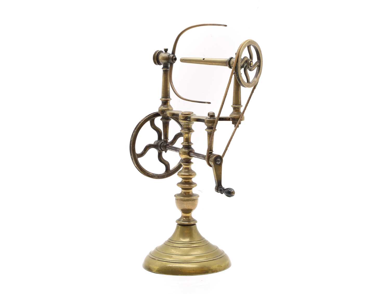 Lot 309 - A brass yarn spinning wheel