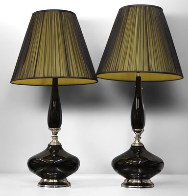 Lot 482 - A pair of black glass and chrome table lamps