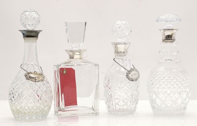 Lot 22 - Four modern glass and silver mounted decanters