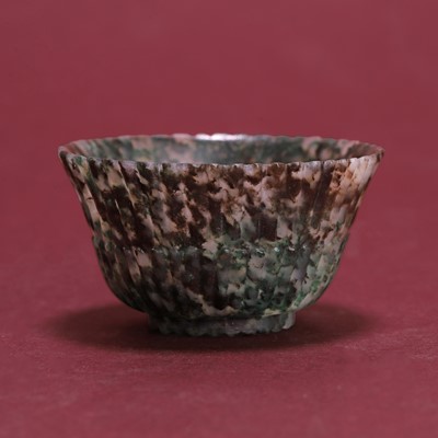 Lot 32 - A Chinese carved mottled-hardstone cup