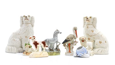 Lot 106 - A collection of Staffordshire pottery figures