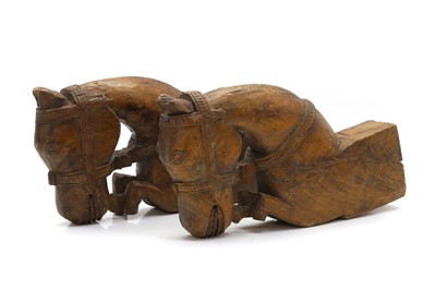 Lot 256 - A pair of Indian teak brackets