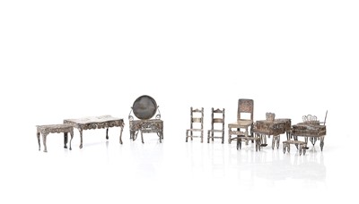 Lot 301 - A set of filigree white metal dolls house furniture