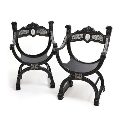 Lot 173 - A pair of ebonised and ivory-inlaid Savonarola-type chairs