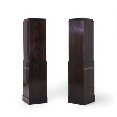 Lot 46 - A pair of Art Deco coromandel, ebonised and ivory-inlaid pedestal cupboards