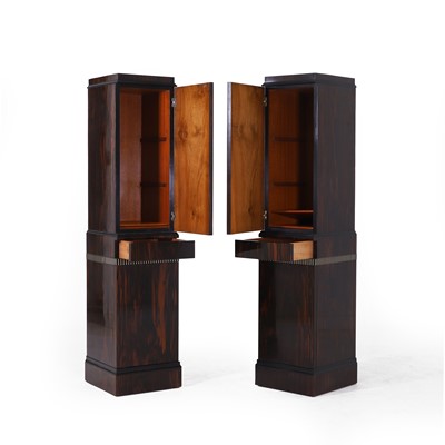 Lot 46 - A pair of Art Deco coromandel, ebonised and ivory-inlaid pedestal cupboards