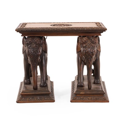 Lot 62 - A carved teak side table