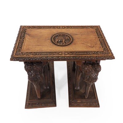 Lot 62 - A carved teak side table