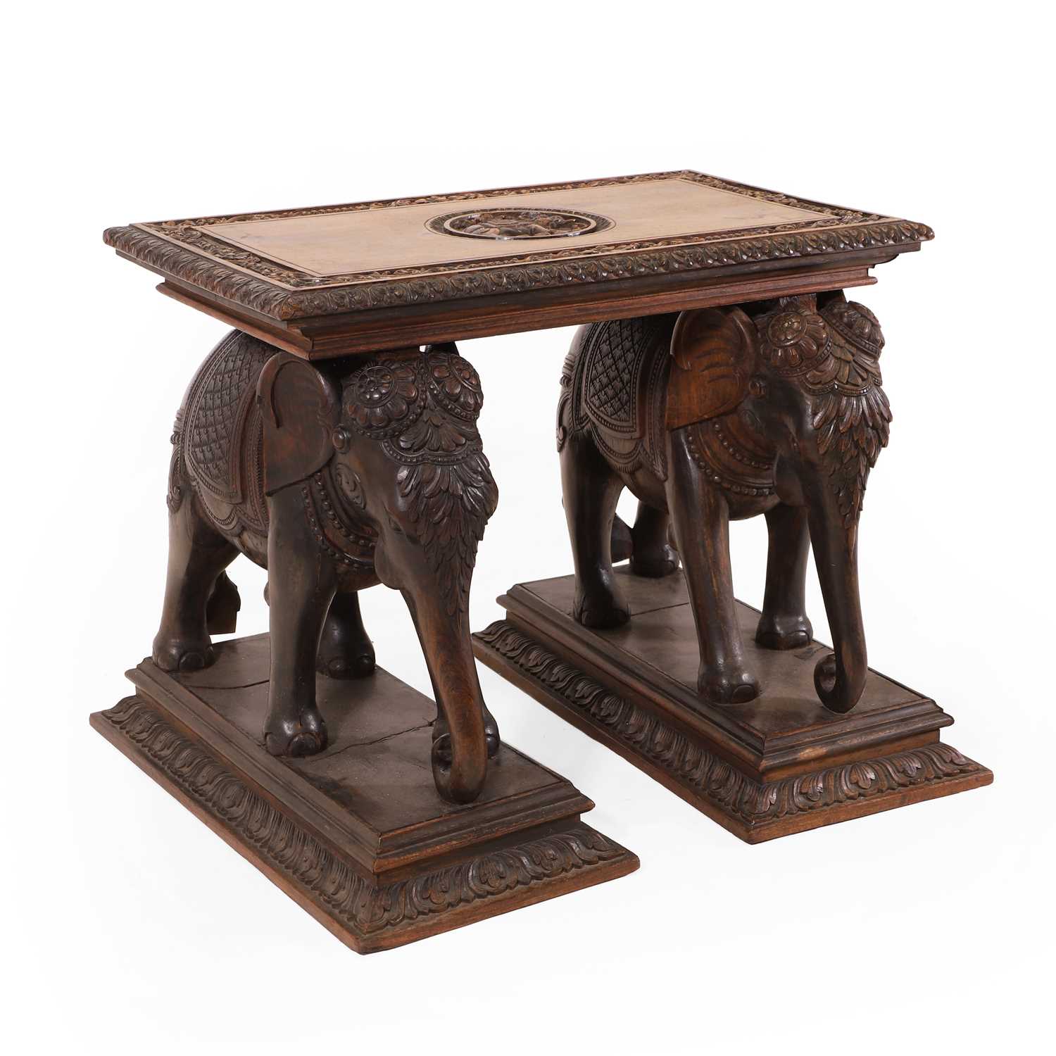 Lot 62 - A carved teak side table