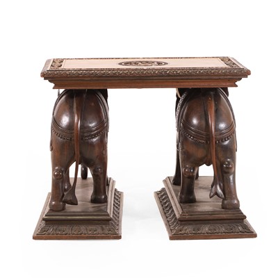 Lot 62 - A carved teak side table