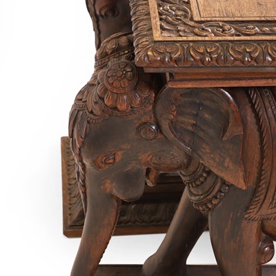 Lot 62 - A carved teak side table