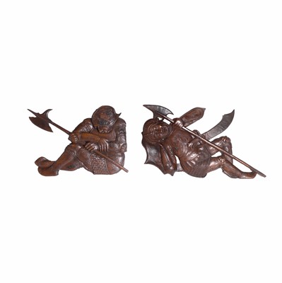 Lot 186 - A pair of carved walnut recumbent soldiers