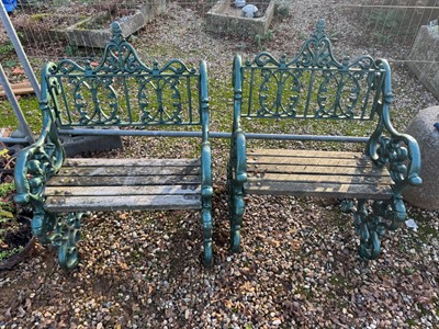 Lot 536 - A pair of cast iron armchairs and a matching table