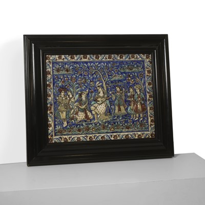 Lot 15 - A large Qajar moulded and underglaze-painted pottery figural tile