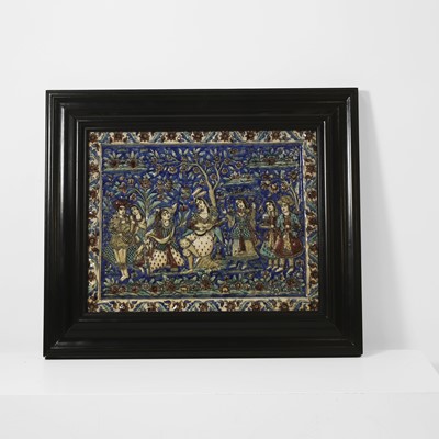 Lot 15 - A large Qajar moulded and underglaze-painted pottery figural tile