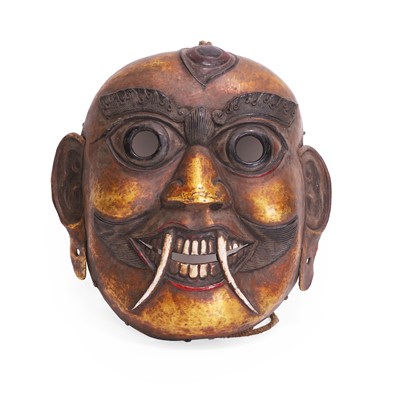 Lot 86 - A Tantric Buddhist gilt-bronze repoussé mask