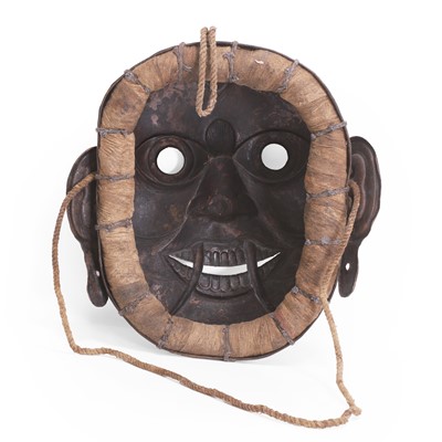 Lot 86 - A Tantric Buddhist gilt-bronze repoussé mask