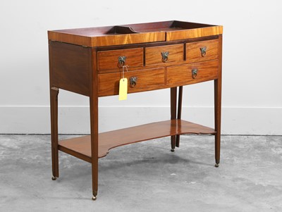 Lot 506 - A bow front dressing table