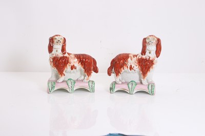 Lot 114 - A pair of Staffordshire pottery spaniels