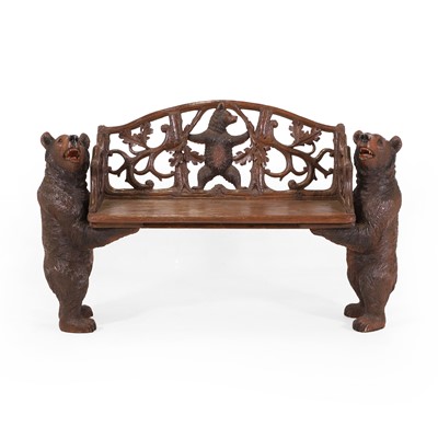 Lot 81 - A Black Forest carved linden wood bench