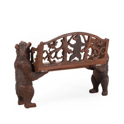 Lot 81 - A Black Forest carved linden wood bench