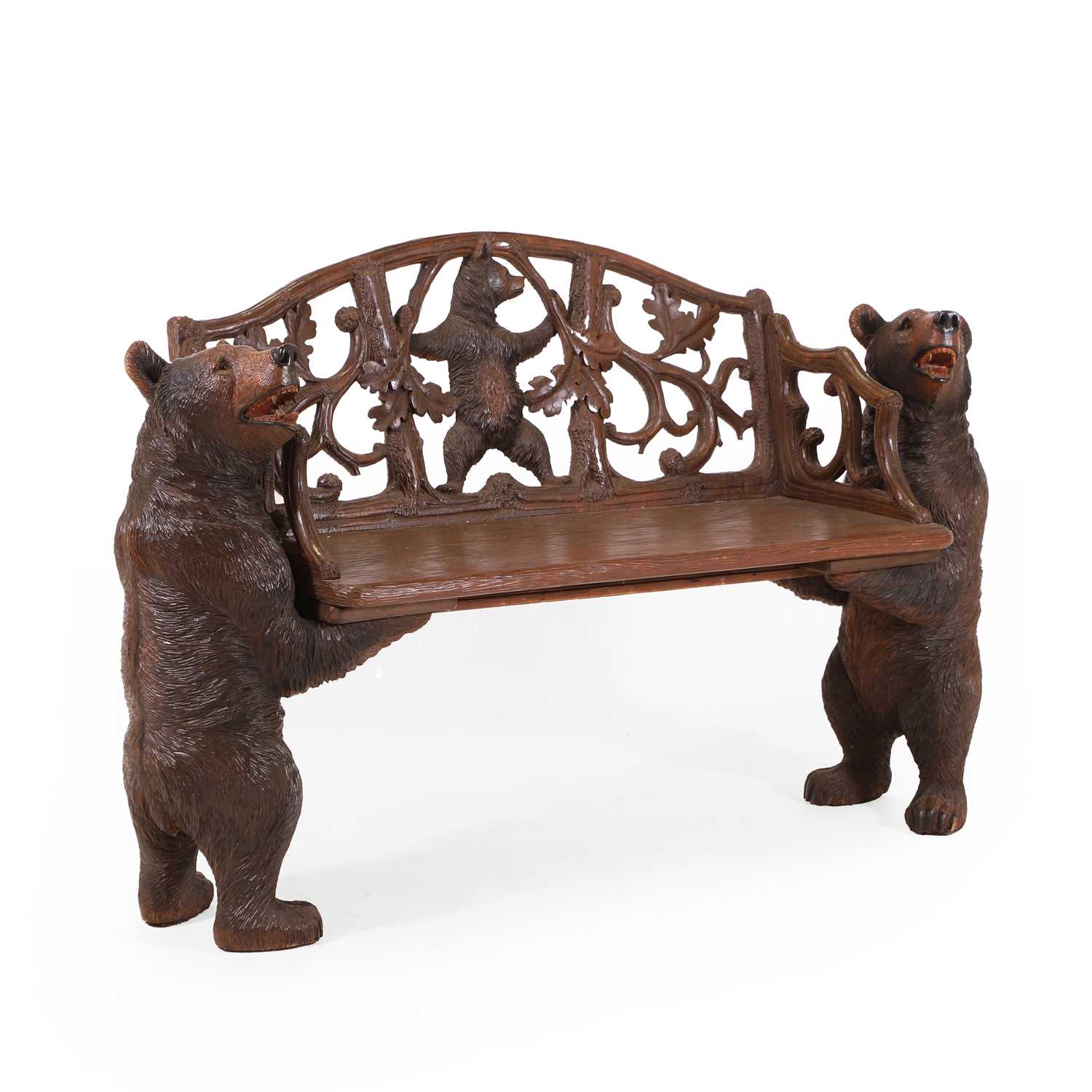 Lot 81 - A Black Forest carved linden wood bench
