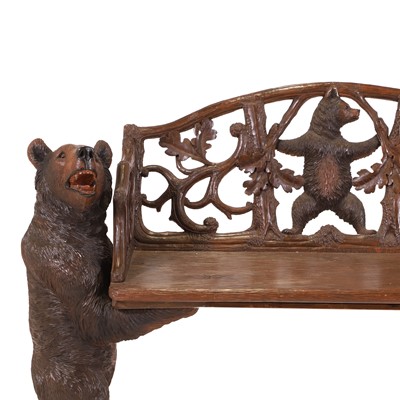 Lot 81 - A Black Forest carved linden wood bench