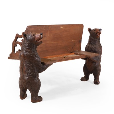 Lot 81 - A Black Forest carved linden wood bench