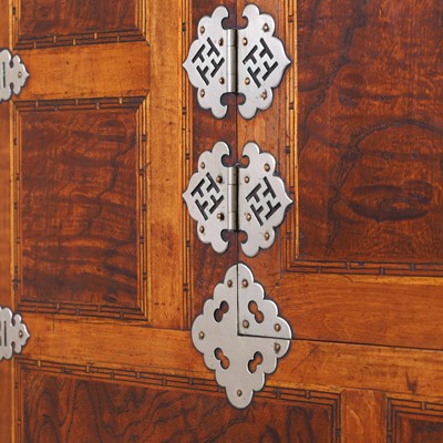 Lot 70 - A pear wood, paulownia and white-metal-mounted 'ich un nong' stackable cabinet