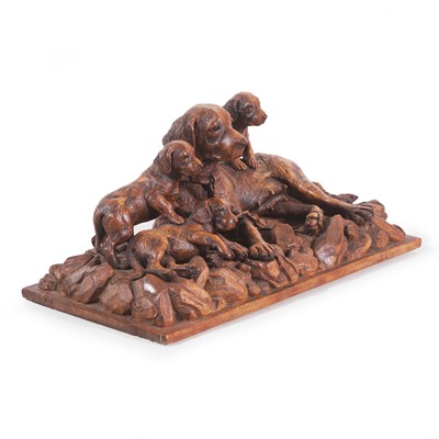 Lot 79 - A Black Forest carved linden wood figural dog group