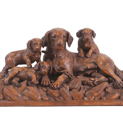 Lot 79 - A Black Forest carved linden wood figural dog group
