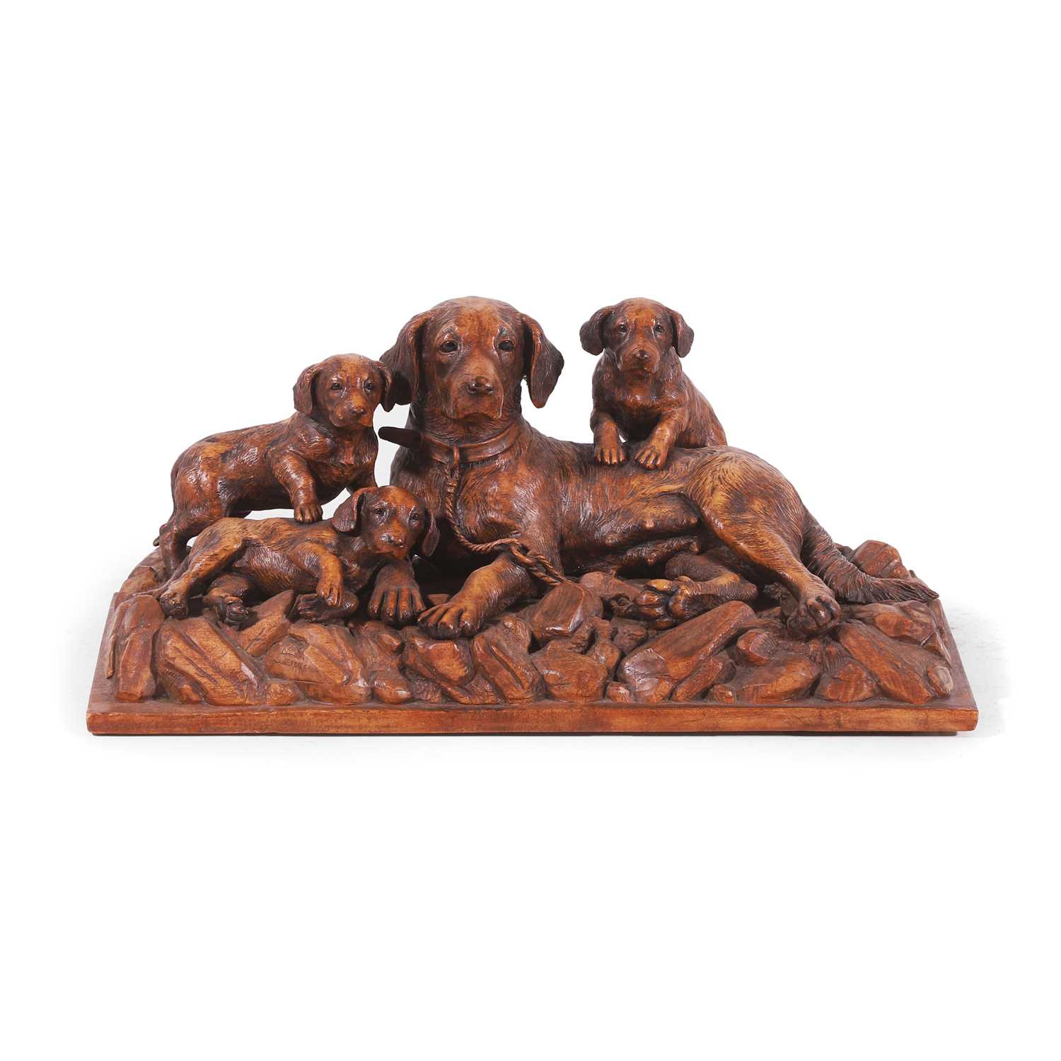 Lot 79 - A Black Forest carved linden wood figural dog group
