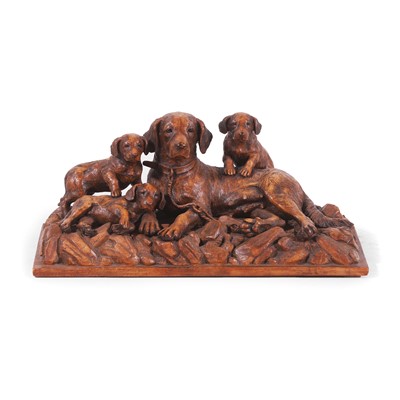 Lot 79 - A Black Forest carved linden wood figural dog group