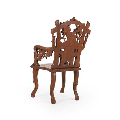 Lot 83 - A carved linden wood Black Forest armchair