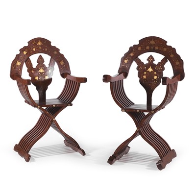 Lot 188 - A pair of hardwood Savonarola-type elbow chairs