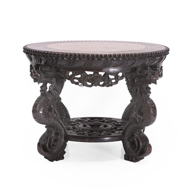 Lot 122 - A carved hardwood jardinière stand