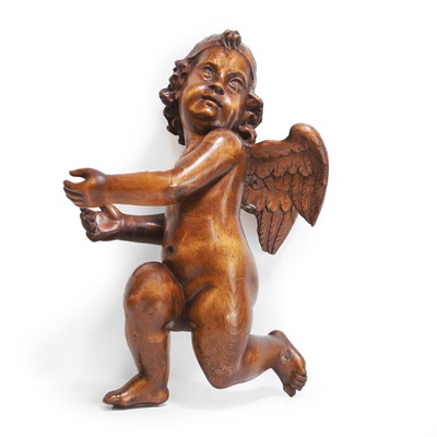Lot 233 - A carved walnut element in the form of a putto