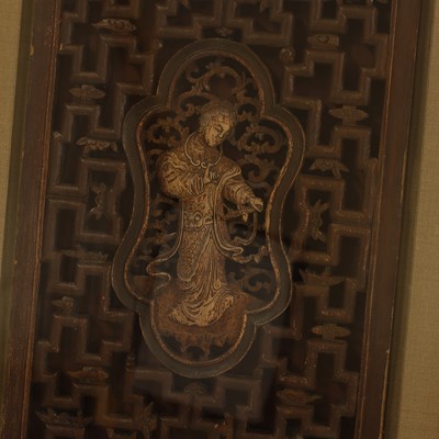 Lot 89 - A set of four pierced and lacquered screen panels