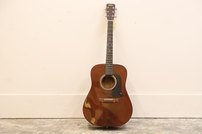 Lot 311 - A Washburn six string acoustic guitar