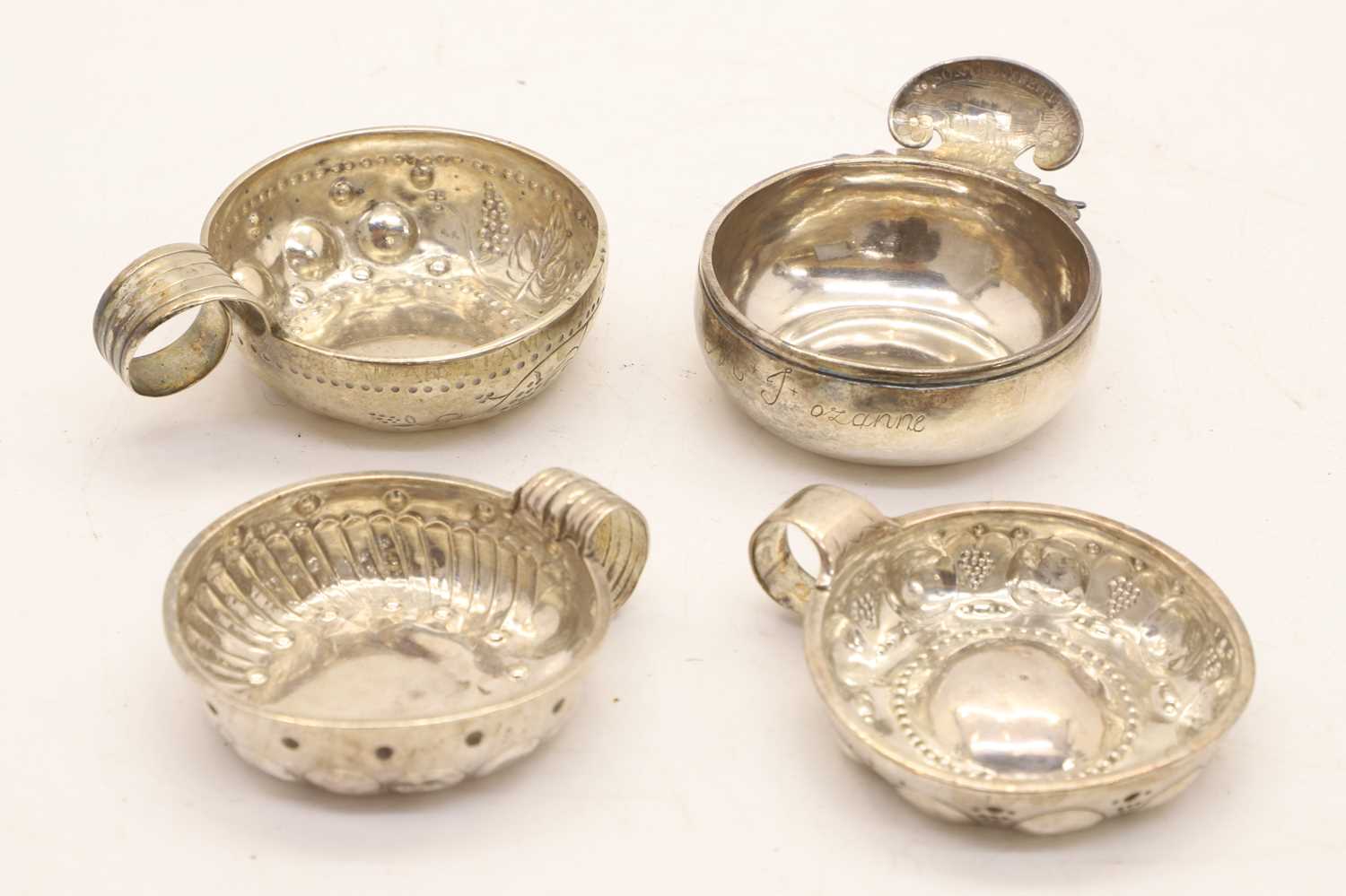 Lot 46 - Four silver taste de vin