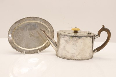 Lot 47 - A Georgian style oval teapot and matching stand