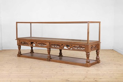 Lot 502 - A long oak display cabinet