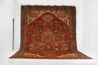 Lot A large Persian Heriz wool carpet