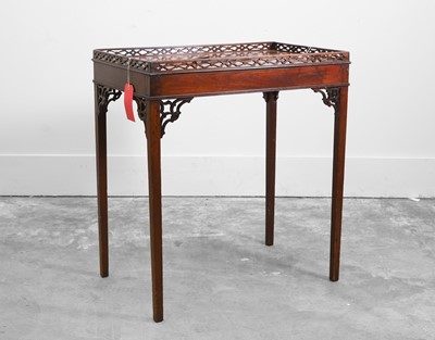 Lot 510 - A mahogany galleried silver table