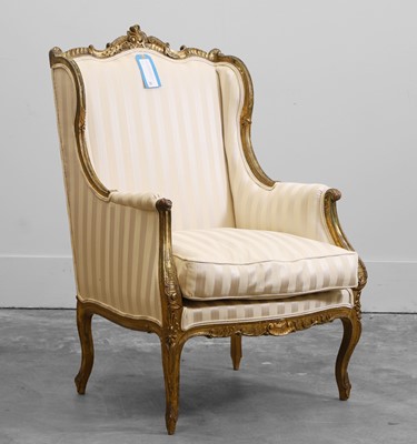 Lot 505 - A Louis XV style carved giltwood armchair