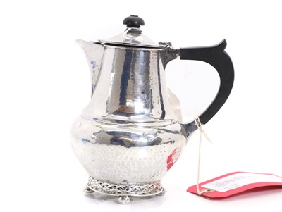 Lot 33 - A silver planished coffee pot